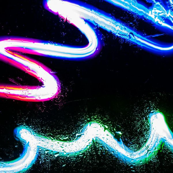 Flowing neon lines representing energy and continuity